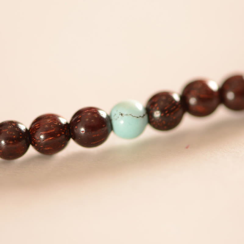 Braunes Sandelholz Armband mit mintgrünem Stein Perlen Schmuck.