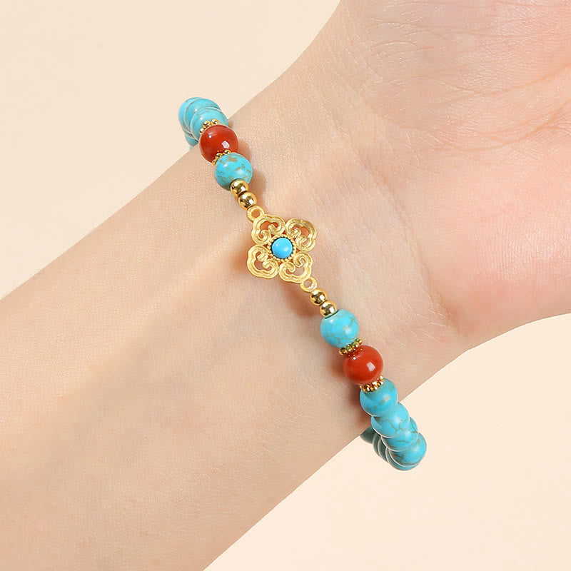 Armband Türkis – Schutz & Balance mit rotem Achat Golddetails Handgelenk