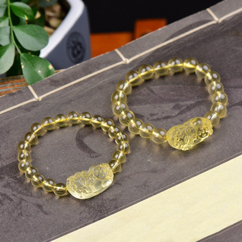 Armband Citrin Pixiu – Wohlstand zwei gelbe Armbänder mit Anhänger Flachlage