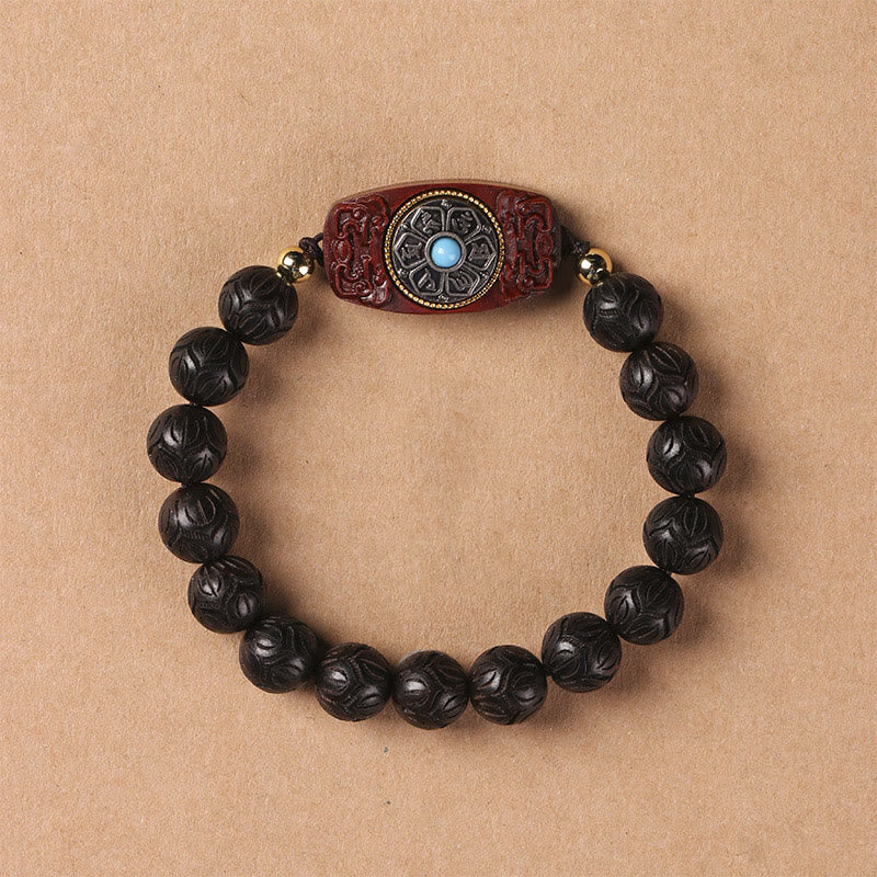 Armband Sandelholz Ebenholz Om Mani Padme Hum mit geschnitzten schwarzen Perlen