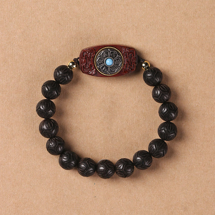 Armband Sandelholz Ebenholz Om Mani Padme Hum mit geschnitzten schwarzen Perlen