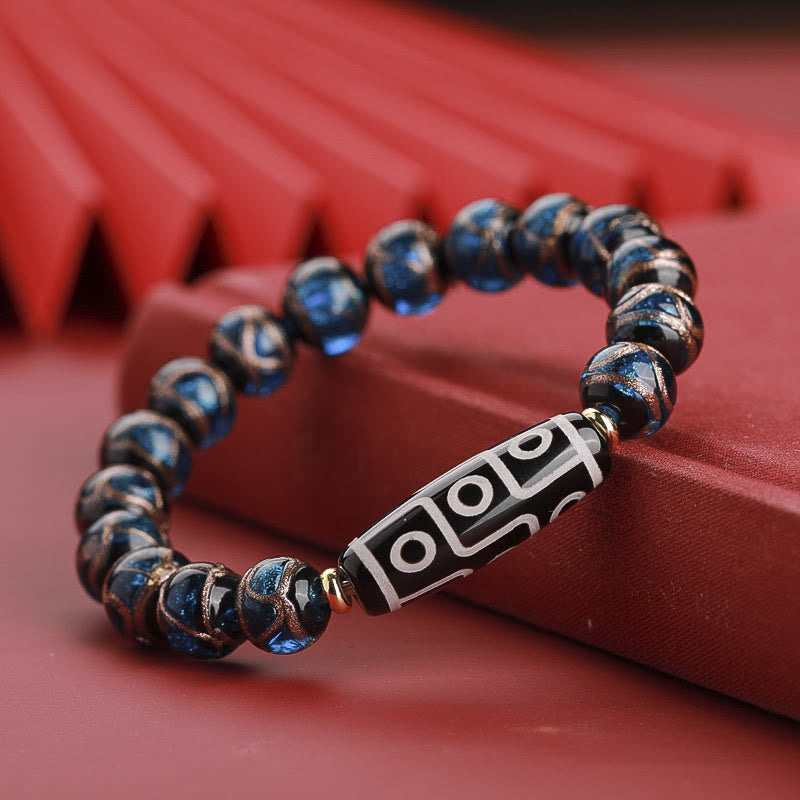 Armband – Wohlstand Balance mit blauen Perlen und Tibetan-Dzi-Stein elegant
