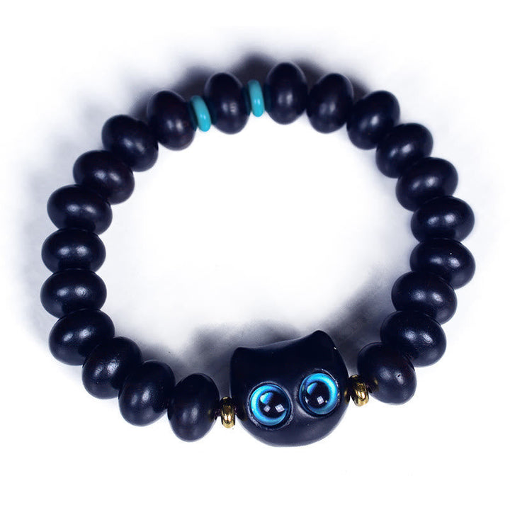 Armband Ebenholz Katze schwarze Perlen blaue Augen Liebe Frieden elastisch