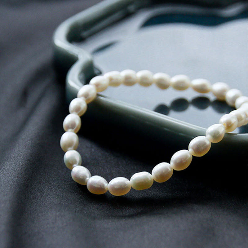 Armband Perle – Heilung Weiße Perlen elastisches Armband elegant getragen