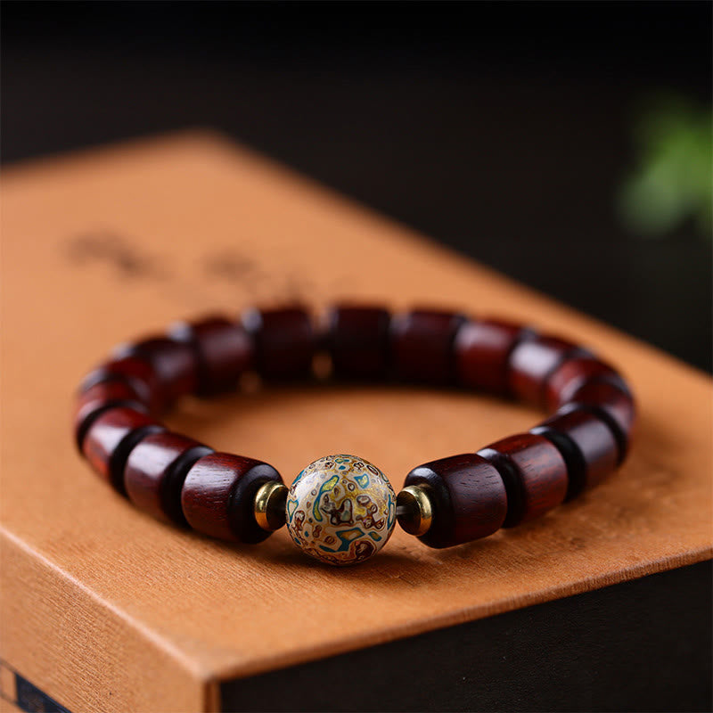 Armband Sandelholz – Frieden Balance mit braunen Holzperlen und verzierter Kugel