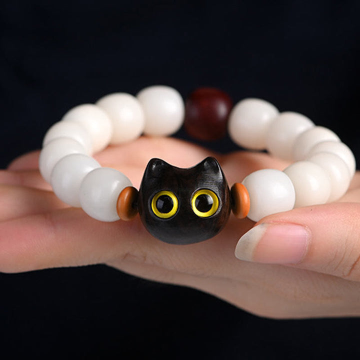 Armband Sandelholz Bodhi Katze schwarze Glückskatze weiße Perlen Handgelenk