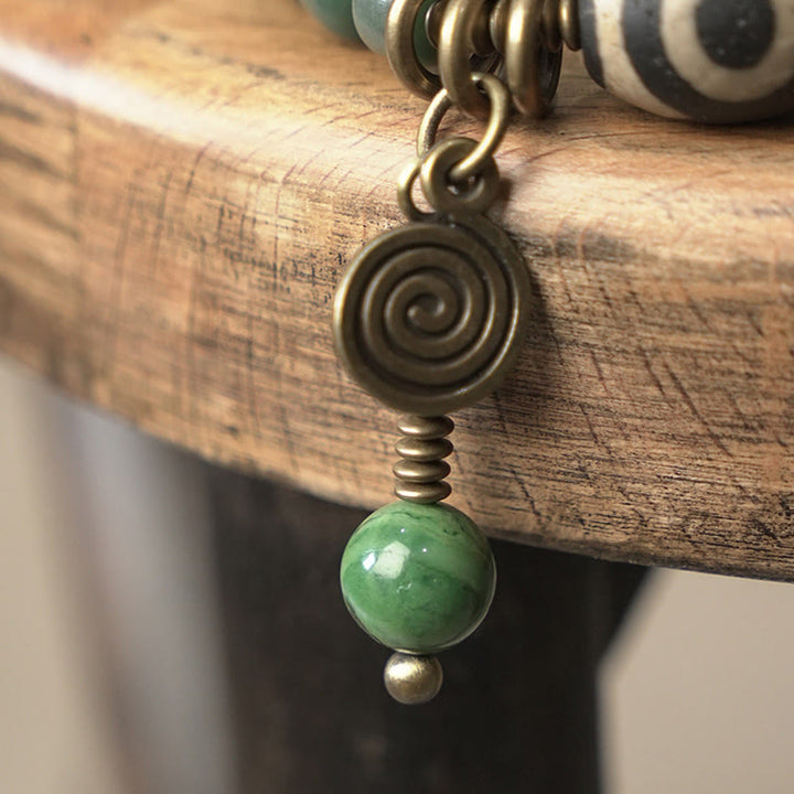 Armband Bodhi – Frieden grüner Stein Spirale Bronzekette Holz