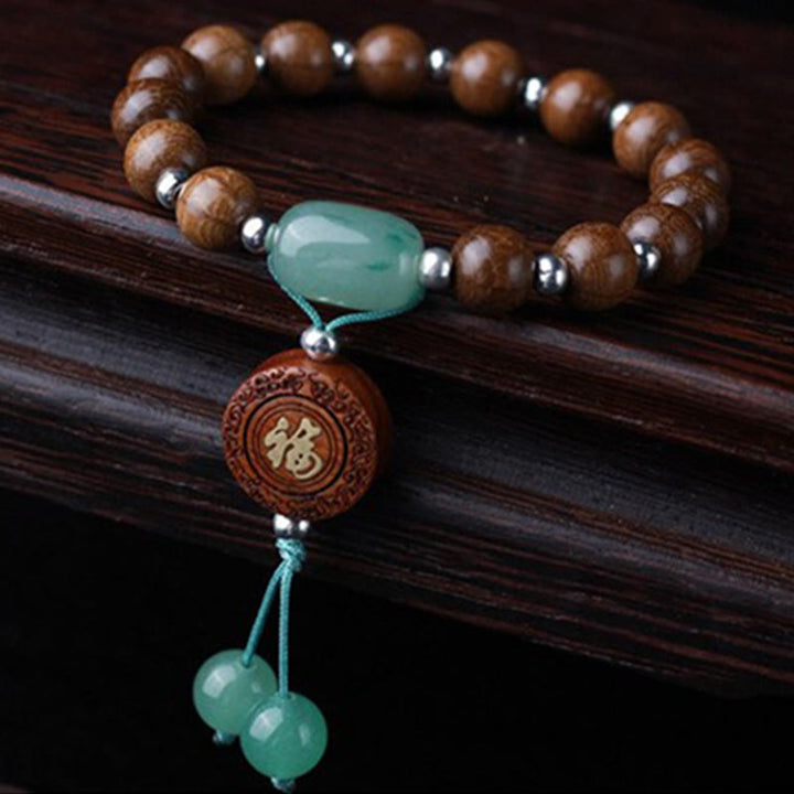 Holzperlen Armband mit grünem Jade Anhänger und Holzmedaillon Schutz Glück Harmonie