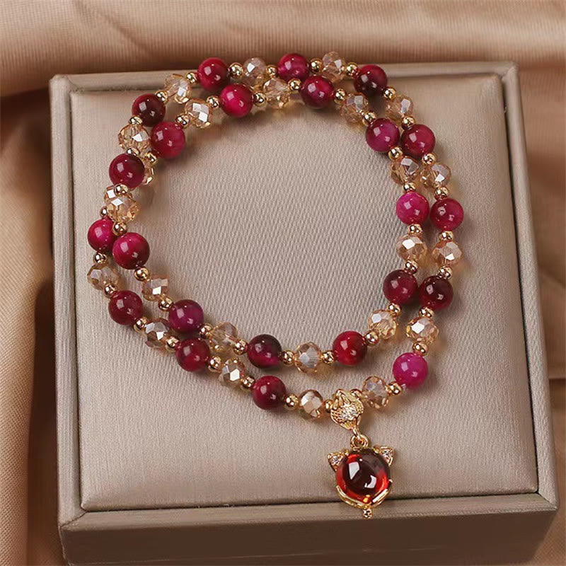 Rotes Armband mit Granat- und Kristallperlen Goldakzenten Anhänger.