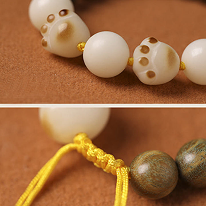 Armband Sandelholz Bodhi Katze weiße Perlen elastisch Naturstein
