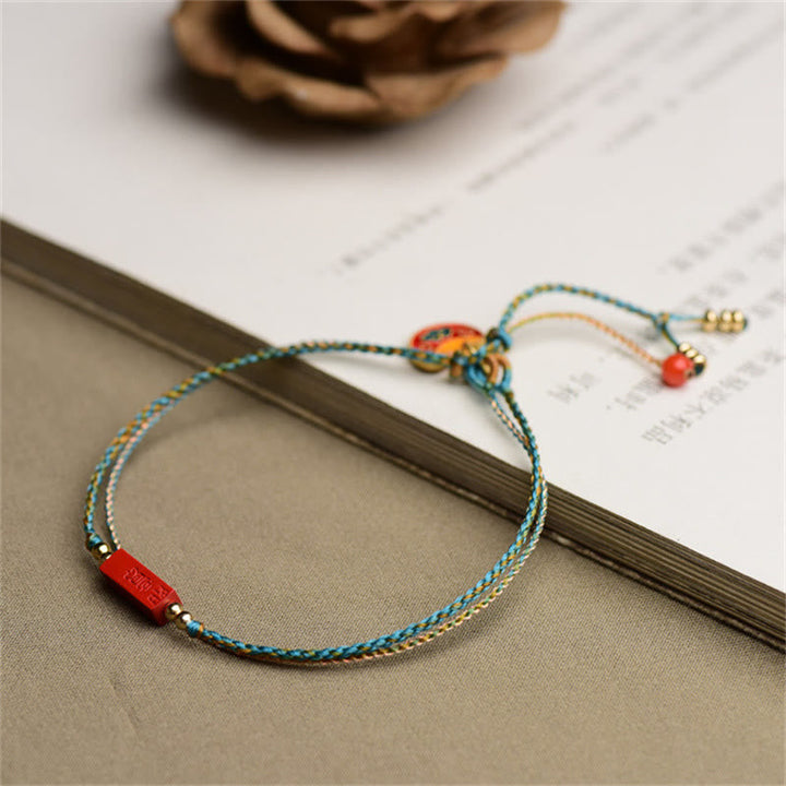 Armband Zinnober – Segen & Balance mit roten Perlen Seidenschnur