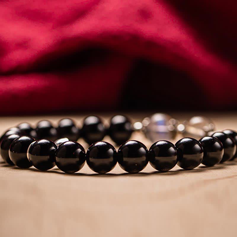 Schwarzes Obsidian Armband mit glänzenden Perlen Naturstein elastisch