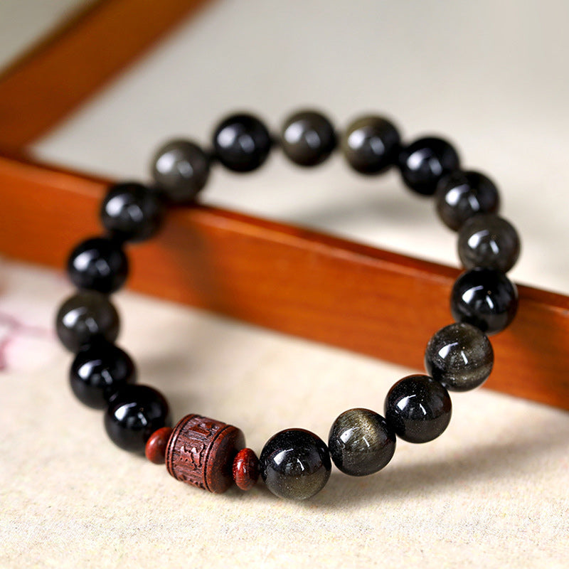 Schwarzes Obsidian Armband mit Om Mani Padme Hum Anhänger elegant.