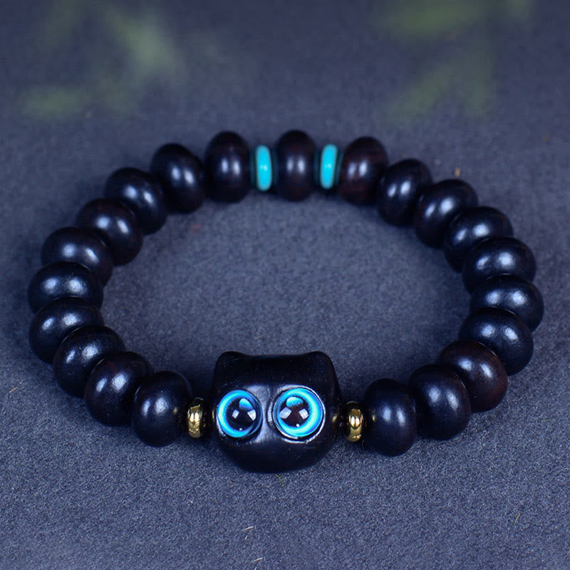 Armband Ebenholz Katze schwarze Perlen blaue Augen Liebe Frieden