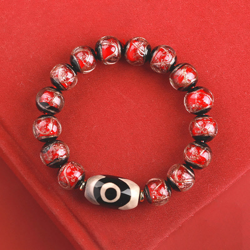 Armband – Wohlstand Balance rotes Perlenarmband mit schwarzweißem Auge Stein