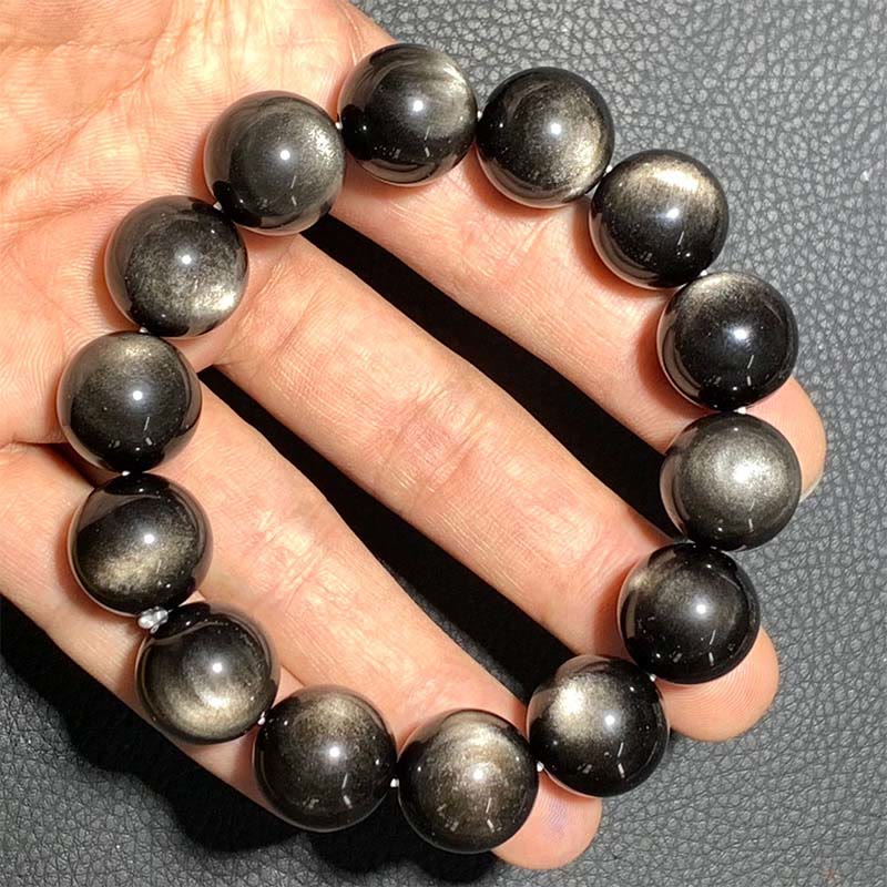 Obsidian Armband Silber Schutz schwarze Perlen Naturstein Handgelenk getragen