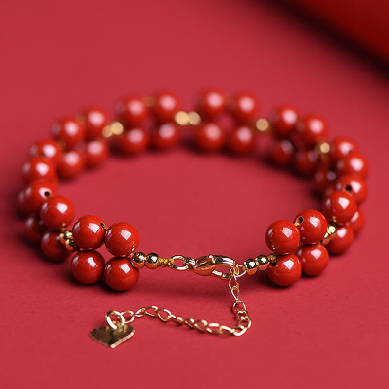 Armband Zinnober – Segen Harmonie rote Perlen Goldverschluss elegant.