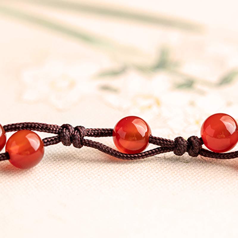 Armband Roter Achat Zinnober mit braunem Seil Knoten elastisch.