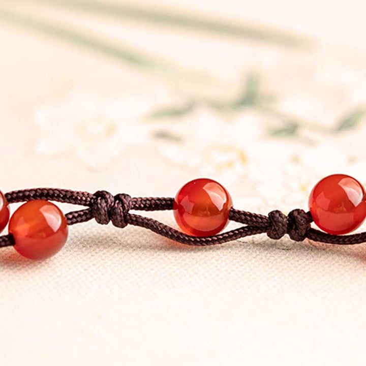 Armband Roter Achat Zinnober mit braunem Seil Knoten elastisch.