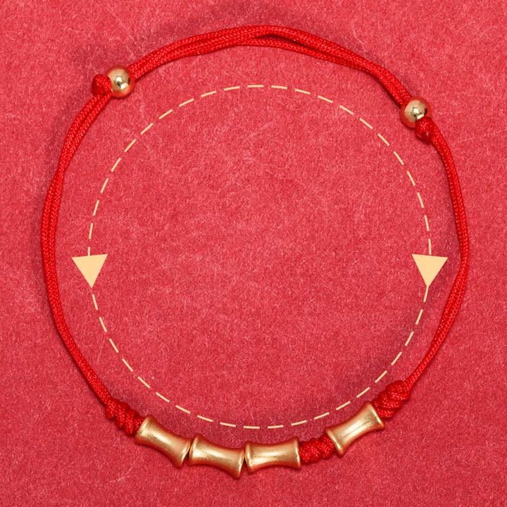 Rotes Armband mit Bambus-Elementen, Schutz und Glück symbolisierend