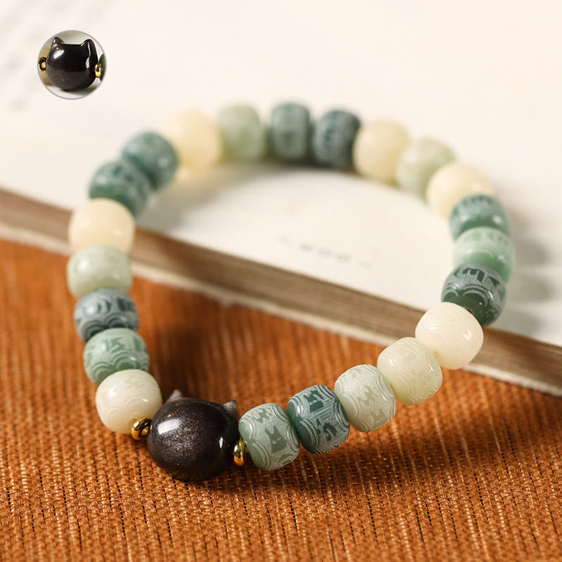Armband mit schwarzem Obsidian und grünen Bodhi-Perlen elegant arrangiert