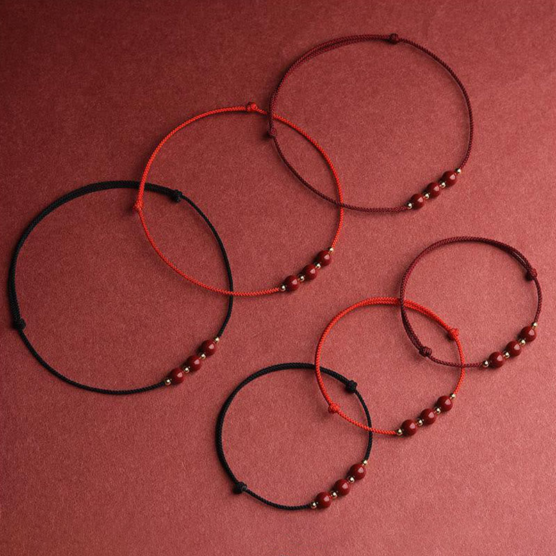 Armband Zinnober – Glück & Segen in Rot und Schwarz Flachlage Naturstein