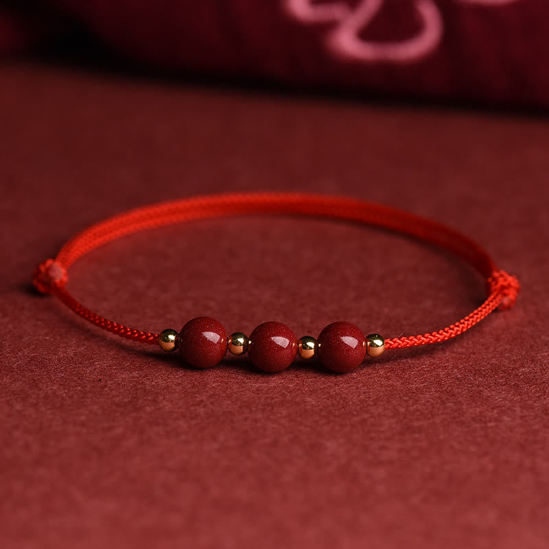 Rotes Armband Zinnober – Glück & Segen mit Perlen auf Stoff