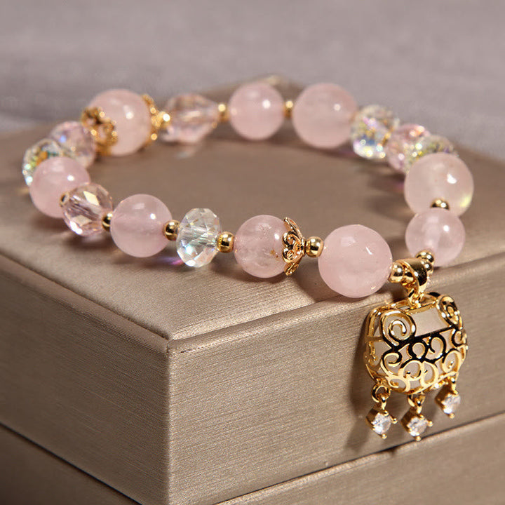 Rosenquarz Kristall Armband mit goldenem Ornament Anhänger elegant