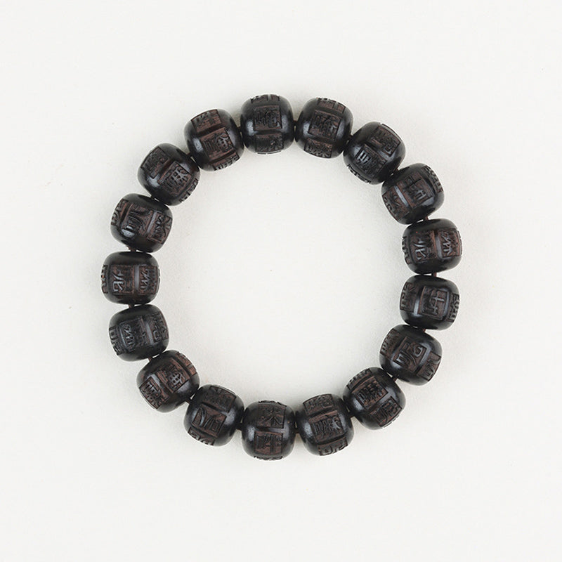 Armband Ebenholz Om Mani Padme Hum mit geschnitzten schwarzen Perlen elastisch