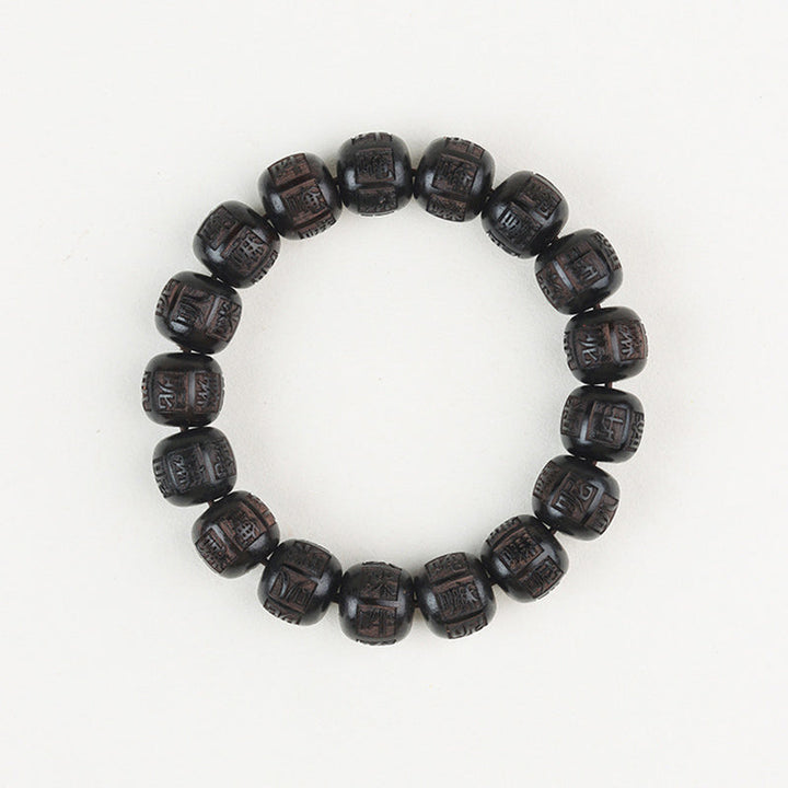 Armband Ebenholz Om Mani Padme Hum mit geschnitzten schwarzen Perlen elastisch