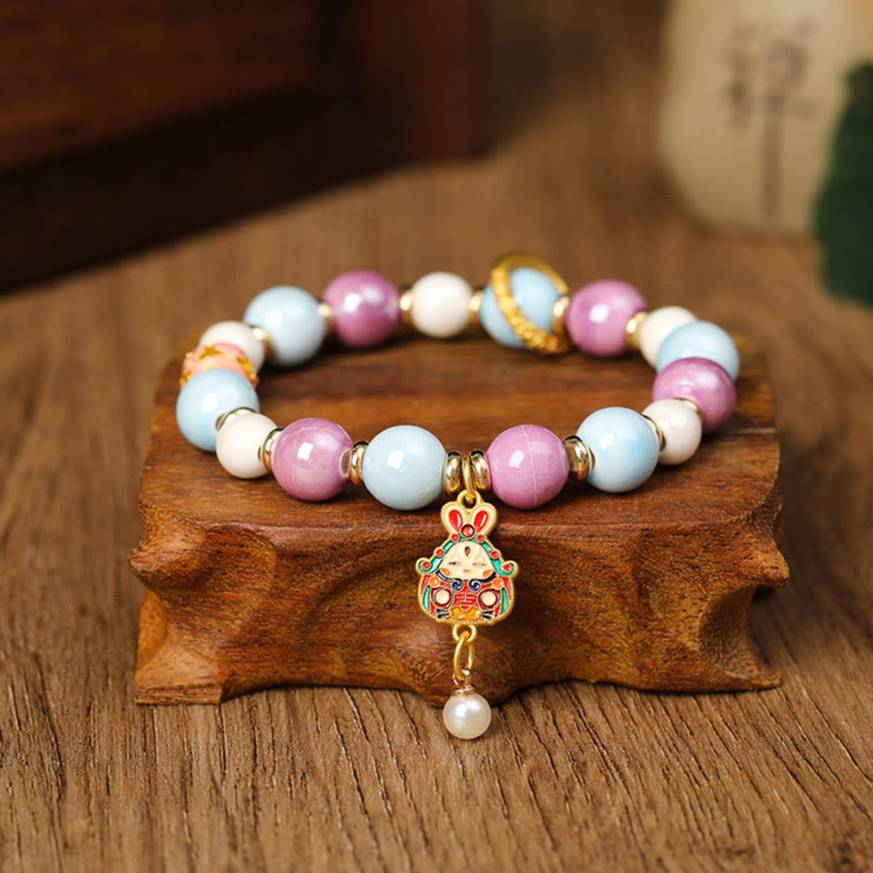 Armband – Schutz & Wohlstand & Energie mit rosa weißen Perlen Charm.