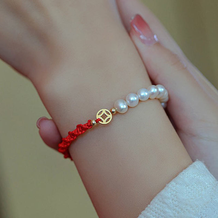 Armband Perle – Schutz & Glück rotes Seil Perlen gold Charm elegant