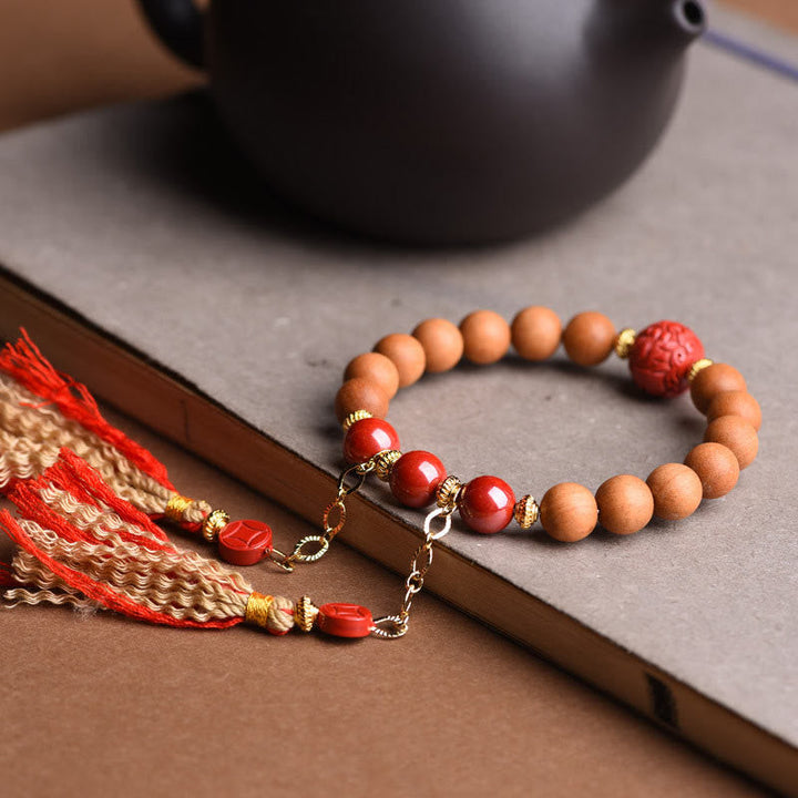Armband Zinnober Pixiu – Wohlstand mit roten Perlen und Holzbeads