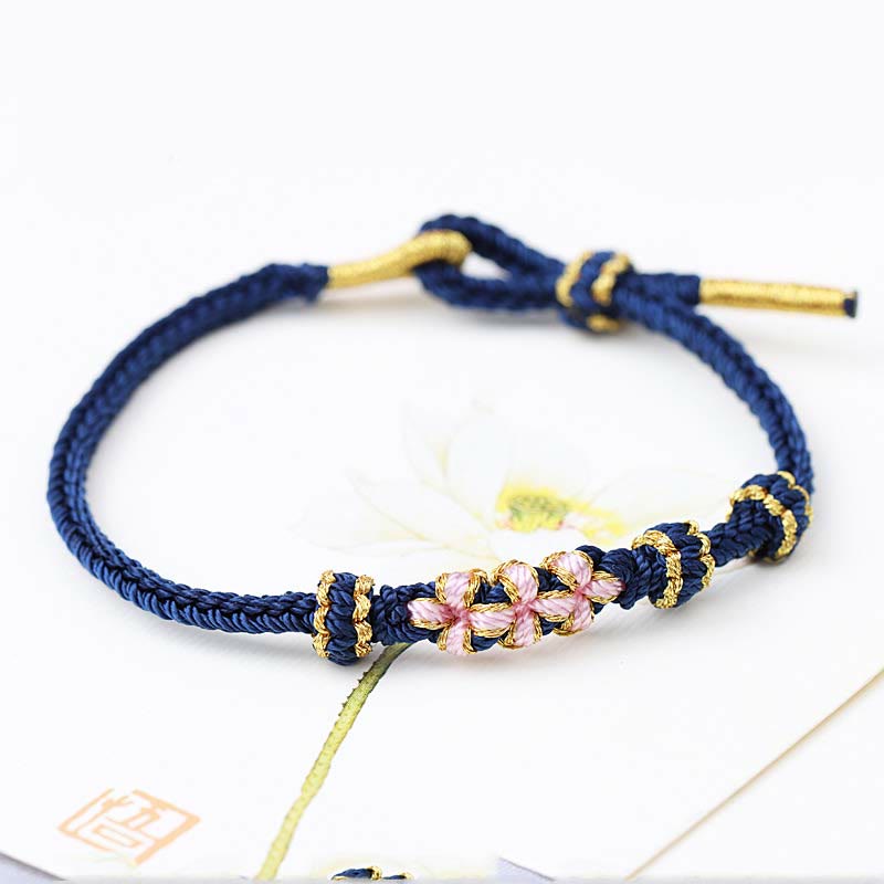 Armband Pfirsichblüte – Glück dunkelblau mit rosafarbenen Perlen