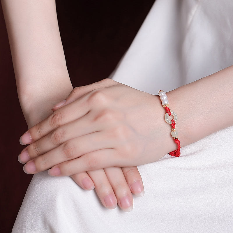 Armband 925 Silber Perle Glück Frieden Kinderhand weiß elegant