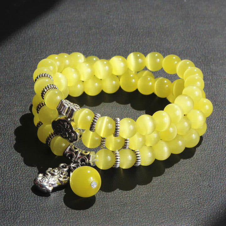 Gelbes Katzenauge Armband PiXiu Dreifach mit silbernen Perlen elegant.