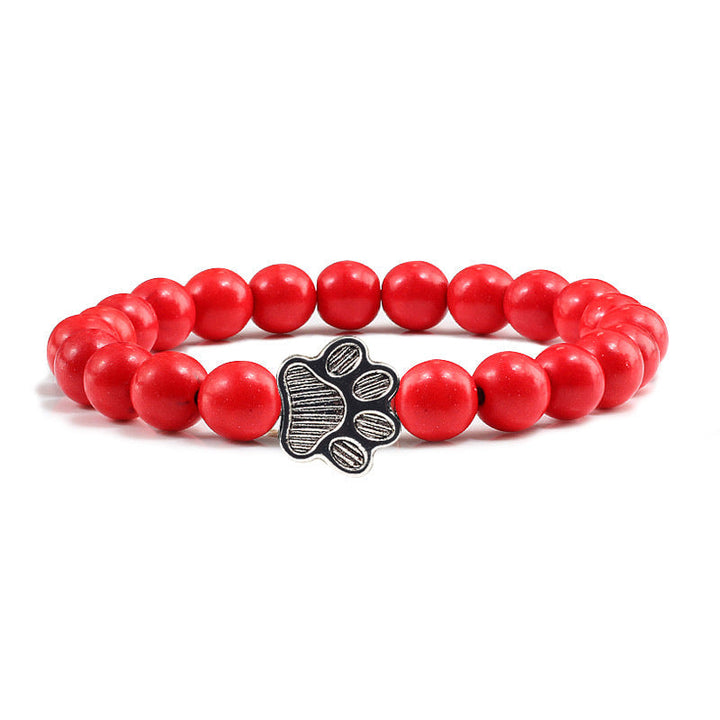 Rotes Perlenarmband mit Hund Charm Anhänger elastisch.