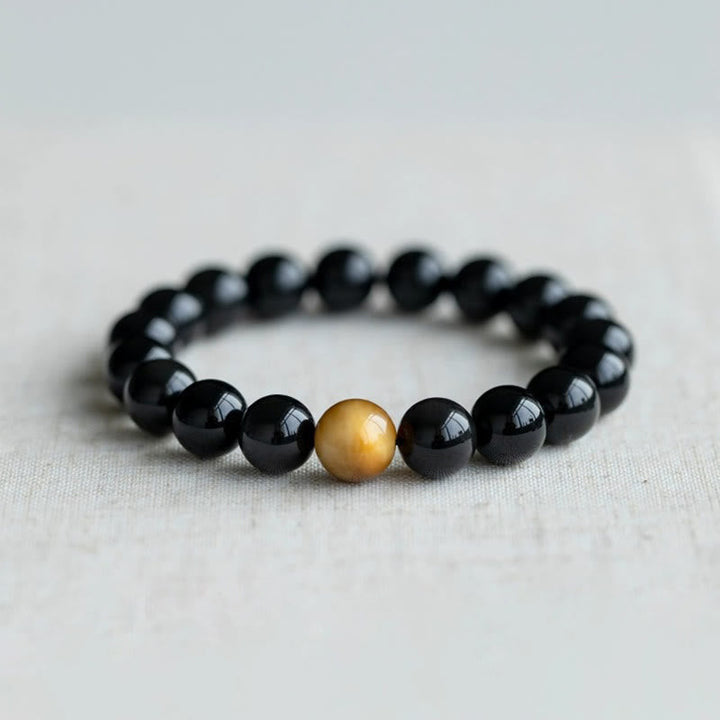 Armband Tigerauge Obsidian – Liebe schwarze Perlen goldene Akzentperle elastisch