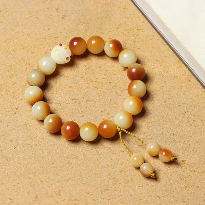 Bodhi Armband mit cremefarbenen und braunen Perlen Tassel