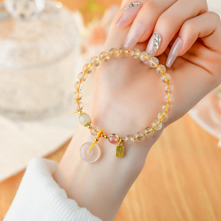 Armband Fu-Zeichen Wohlstand Frieden Citrin Perlen goldene Fassung elegant.