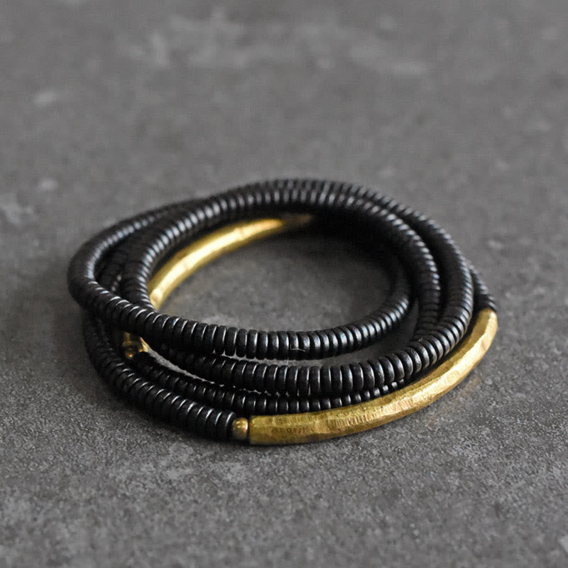 Armband Kupfer Ebenholz Balance schwarze Perlen goldene Akzente elastisch
