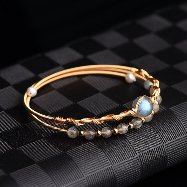 Armband Mondstein Mond auf schwarzem Stoff, goldfarben mit grauen Steinen