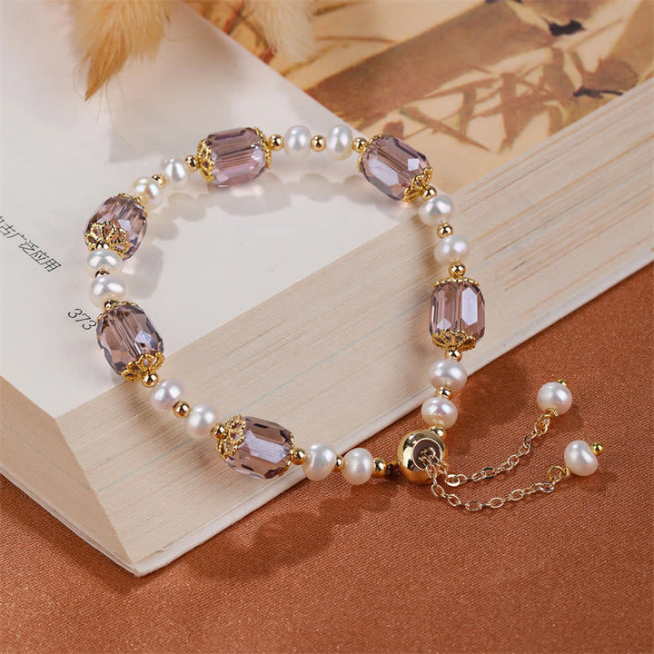 Armband Amethyst Perle mit lila Kristallen und Perlen elegant.