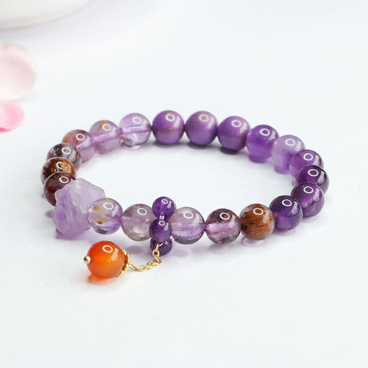 Armband Amethyst Lila Phantom Edelstein mit orangem Anhänger elastisch