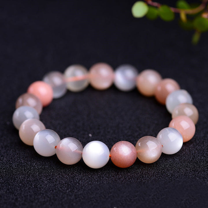 Mondstein Armband mit rosa und weißen Perlen, elastisch.