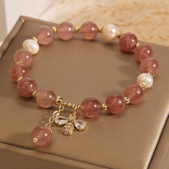 Armband Erdbeerquarz Perle gold Charme elegantes Design Naturstein.