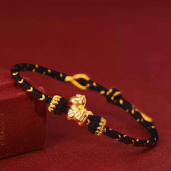 Armband 999 Gold Jahr Des – Glück & Energie geflochten rot Hintergrund