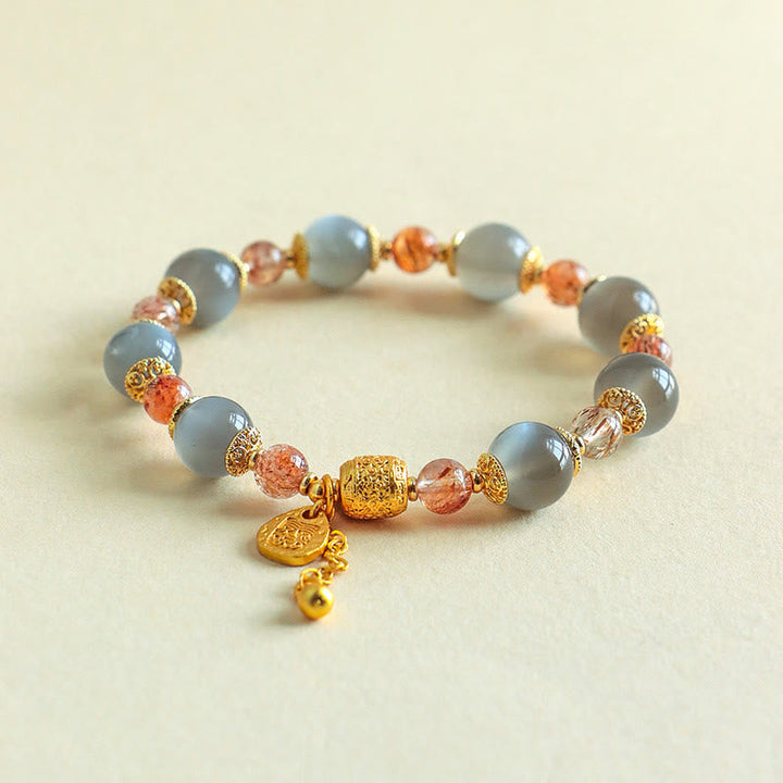 Armband Erdbeerquarz Mondstein Mond Heilung Positivität goldene Perlen Anhänger