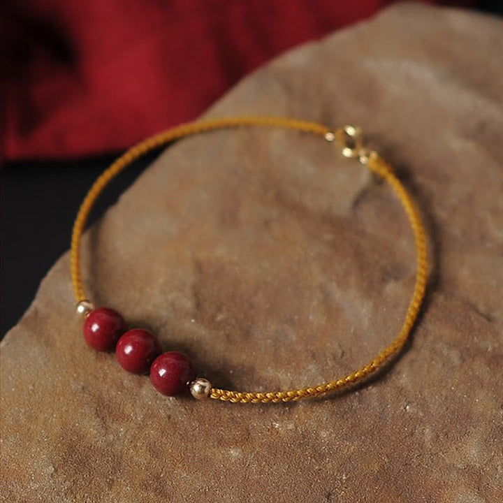Armband Zinnober – Segen & Segen goldenes Seil rote Perlen elegant