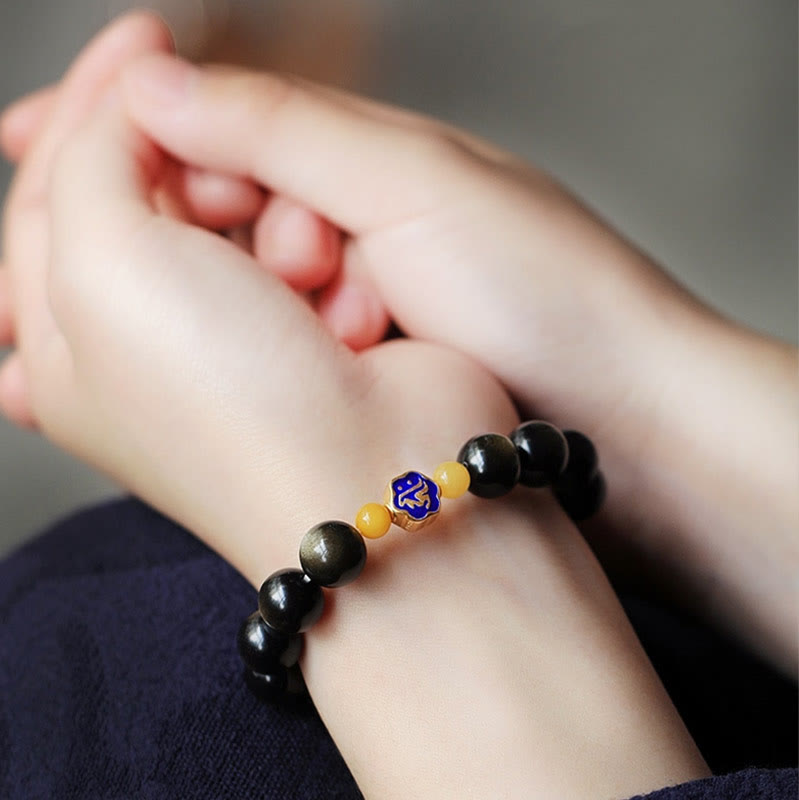 Schwarzes Obsidian Armband mit goldenem Chinesisches Tierkreis Charm elastisch.